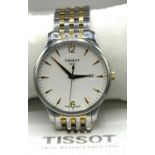Tissot quartz wristwatch with date, signed dial with applied Arabic, baton hour markers and centre