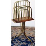 Art Deco brass and oak swivel two division magazine rack on three outsplayed legs, stamped Rd, W39cm