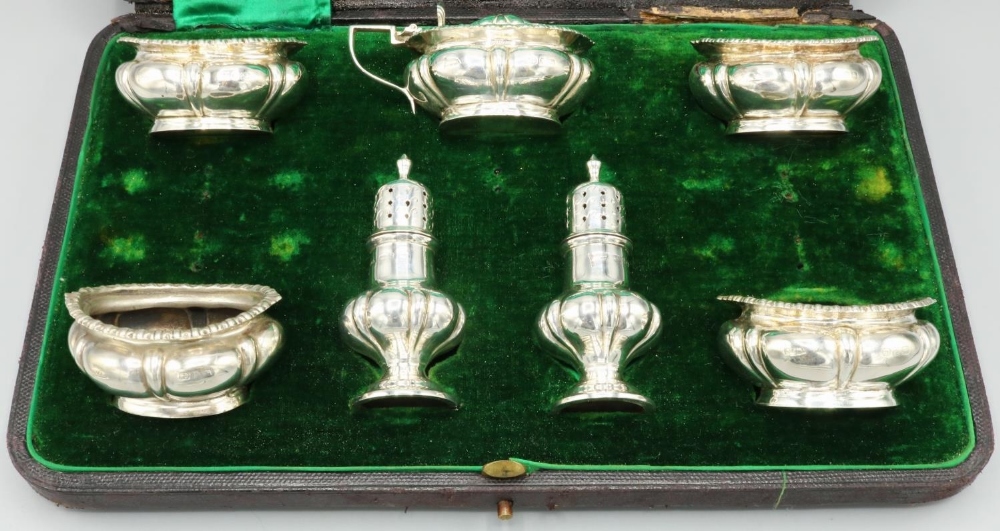 Victorian hallmarked silver seven piece cruet set, lobed bodies with gadrooned borders by Walker &