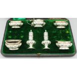 Victorian hallmarked silver seven piece cruet set, lobed bodies with gadrooned borders by Walker &