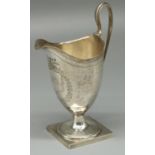 George III hallmarked silver helmet shaped pedestal cream jug, with dot prick and bright cut