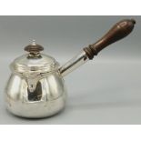 George III hallmarked silver brandy pan with lid, of squat baluster form with hinged spout, turned