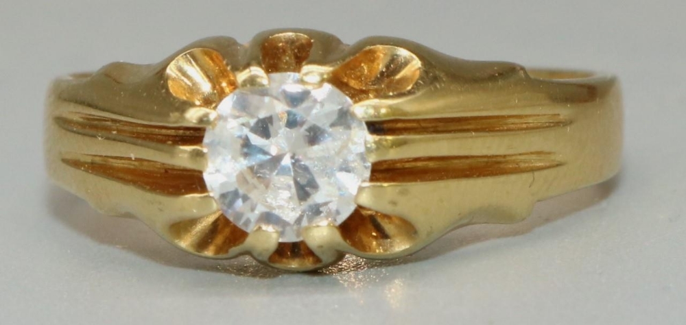 18ct yellow gold solitaire ring, the round cut diamond in claw setting, on grooved shoulders and