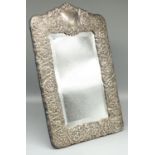 Large Victorian style hallmarked silver easel mirror, relief decorated with scrolls and foliage