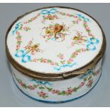 C19th gilt metal mounted white enamel circular box, painted with musical trophies in ribbon tied
