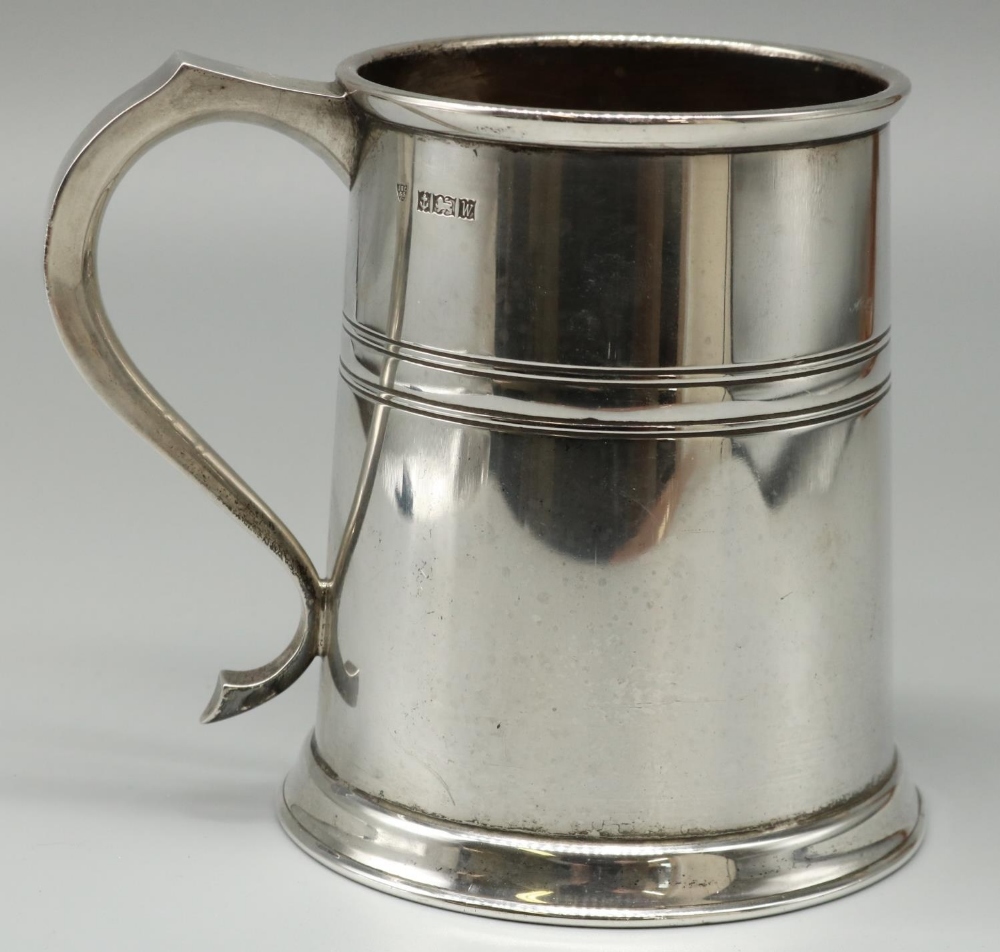 Elizabeth II hallmarked silver Georgian style mug, plain tapering with reeded band and S scroll