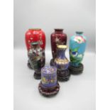 Cloisonne ware lidded pot, 4 cloisonne ware vases and one other vase, all on wood stands (6)