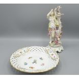 Meissen figure of a lady with birds and a Meissen lattice work plate with floral and gilt decoration