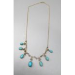 Edwardian 9ct yellow gold drop necklace set with oval cabochon cut turquoise, stamped 9c, L44cm (