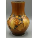 William Moorcroft Leaf and Berry vase, autumnal colours, orange ground, painted and incised