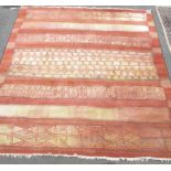 C20th Shalamar wool rug, burnt orange ground with linear striped geometric pattern motifs, 140cm x