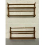 Two Ercol light two tier plate racks, one with blue label, one gold label, 97cm x 50cm (2)