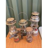 Collection of four "Tilley" style lamps by Coleman and a brass Sievert burner (5)