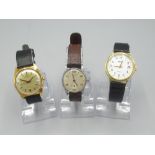 Saga gold plated automatic wristwatch with date, signed gold coloured dial with applied baton hour