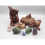 Collection of stone carved animals inc. dog, cat, swan, bear with fish and an ox with monkey,