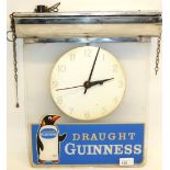 Guinness illuminated suspended advertising clock, Smiths movement, clear Perspex with penguin and