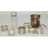 Collection of various George V1 and later hallmarked silver napkin rings, a glass caster with silver