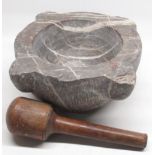 Granite mortar, H15.5cm W38cm and an oak pestle L31cm