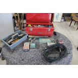 Collection of tools including locks, scissors, hammers, saws, engineers precision square workshop