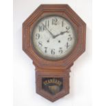 C19th oak cased American Standard Time drop dial wall clock, with white Arabic dial and twin train