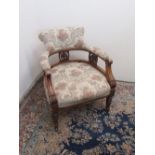 Victorian walnut framed tub type open arm chair, upholstered back, arms and seat on turned