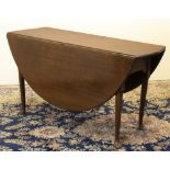 Geo.III mahogany gateleg table, oval top with fall leaves on turned supports with pad feet, W126cm
