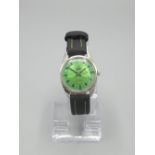 Simon Gregson Collection - Camy Geneve stainless steel hand wound wristwatch, signed green dial with