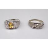 10ct white gold ring set with oval cut citrine, stamped 10k, size T1/2, and another 10k white gold