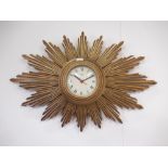 Metamec, Dereham - Mid C20th gilt wood sunburst wall clock, signed cream Roman dial, outer minute