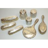 Collection of George V and later hallmarked silver dressing table items incl. four brushes, a mirror