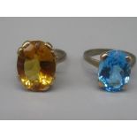 9ct yellow gold ring set with oval cut citrine, size J1/2, and another set with blue topaz, size