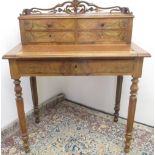 Victorian walnut writing table, galleried four drawer back above slide and long drawer on lobed