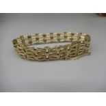 9ct yellow gold three bar gate bracelet with safety chain, stamped 375, 15.8g