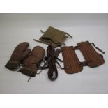 Pair of early C20th boxing gloves, pair of early C20th archery arm braces, leather straps, etc.