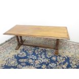 Siesta hardwood rectangular coffee table, on turned supports with floor stretcher, W130cm D54cm