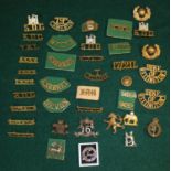 Large collection of metal insignia, including ROYALS, E. SURREY, T CYCLIST, K.D.G. 17/21L etc (39)