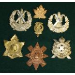 Collection of metal cap badges. The Cameron Highlanders of Ottawa/Canada, The Canadian Scottish,