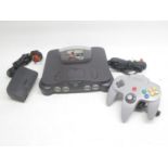 Nintendo 64 with on controller and FIFA 99 game