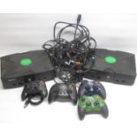 Two Xbox consoles, with original controller, 2 Powerpad Pro controllers and 4 gamers controllers