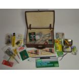 Collection of fishing related tools and accessories, includes forceps, an Orvis knot tyer, hook
