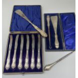 Set of six butter knives with hallmarked Sterling silver repousse handles, marks worn, in fitted