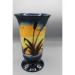 Moorcroft Pottery: Reeds at Sunset pattern footed vase, flared rim, tube lined with water reeds in