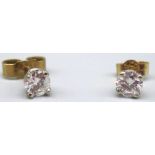 Pair of 9ct yellow and white gold diamond stud earrings, stamped 375, 0.6g