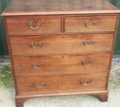 George 111 oak chest of two short and three long graduated ted cockbeaded drawers, with brass