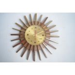 Smiths 1970's battery operated plastic moulded sunburst wall clock, some gold finish rubbed away,