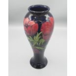 Moorcroft Pottery: Anemone pattern tall baluster vase, tube lined with red and purple flowers on