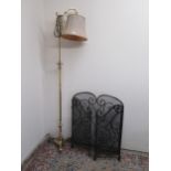 Brass adjustable floor lamp, faceted column on three down curved supports, with shade, H176cm and