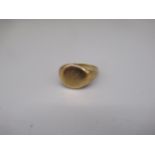 Yellow metal circular signet ring, engraved with initials JW, marks worn, size S, 6.2g