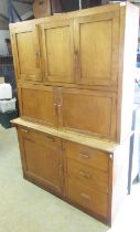 C20th beech kitchen cabinet, the upper section with three cupboard doors over two longer doors above