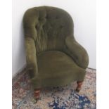 Victorian upholstered armchair with deep buttoned spoon back and serpentine seat on turned